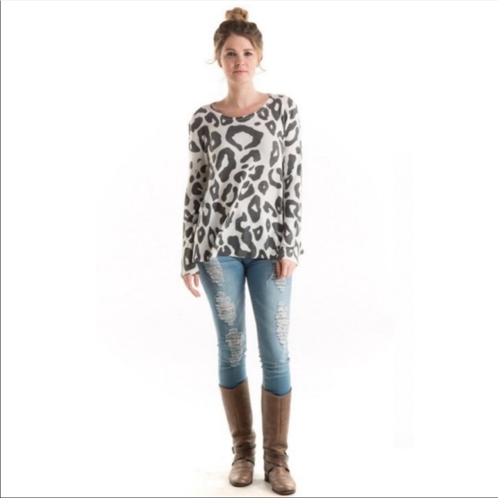 Super soft and cuddly Leopard print sublimated knit Sweater. Medium